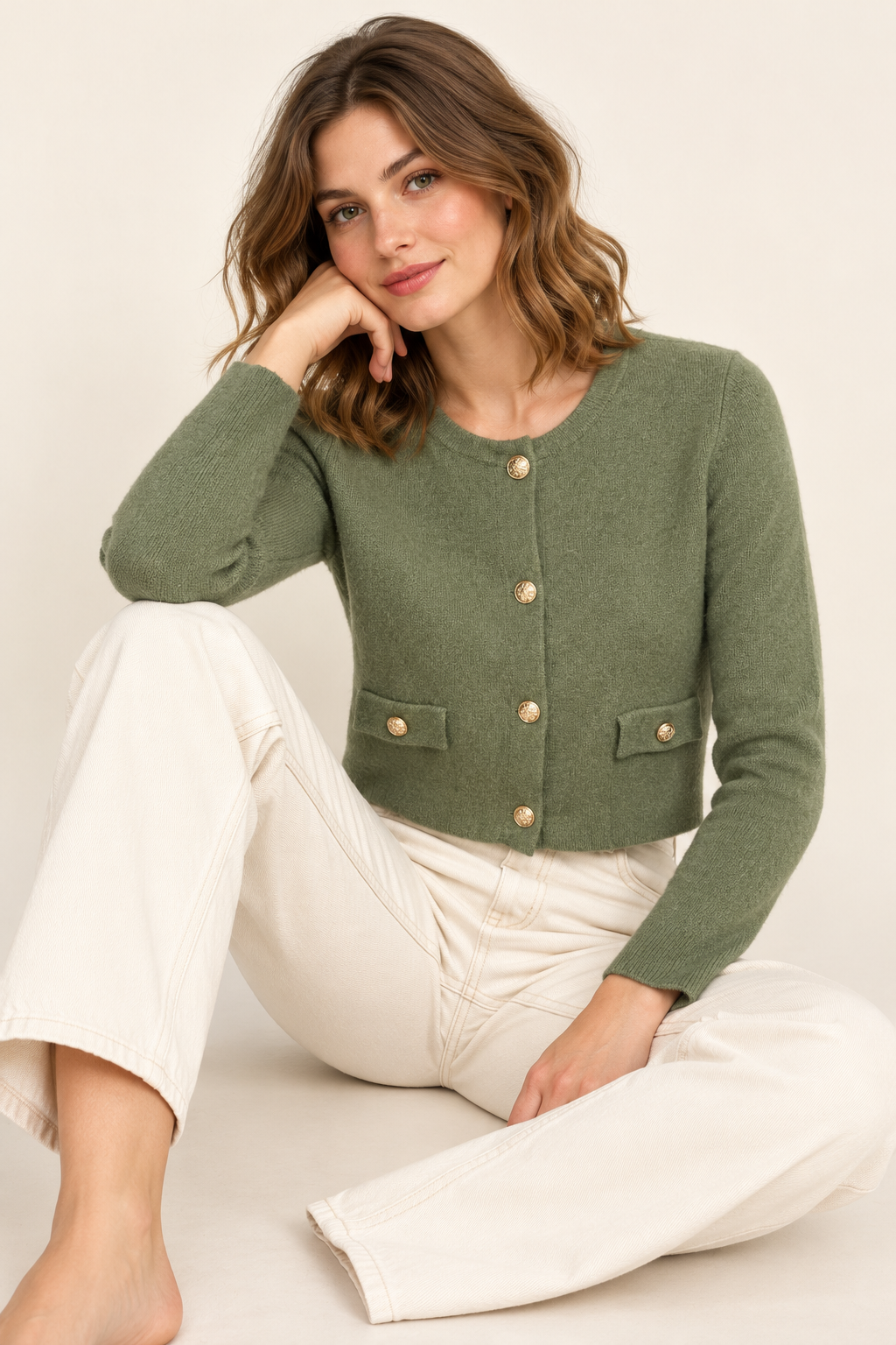 Cardigan verde con bottoni dorati